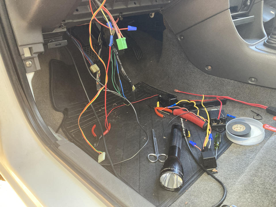 Who put an aftermarket anti-theft system in a car that cost $8,000 new, then TOOK IT HALFWAY OUT before selling it?