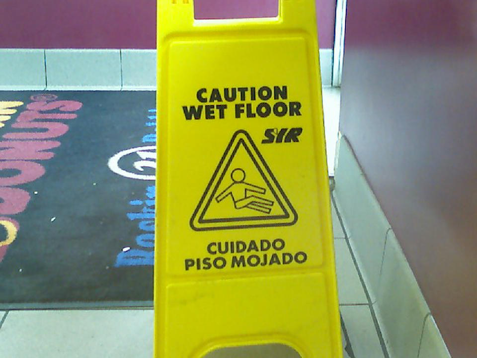 That means "wet floor?" Really? Looks to me like he's relaxing.
